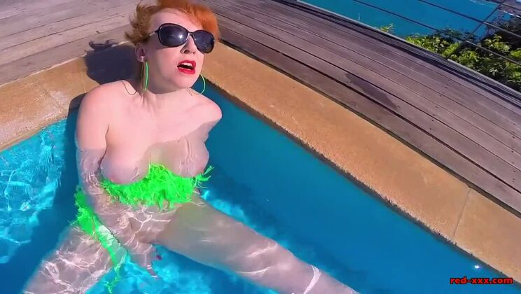 Horny redhead MILF fucks herself in the pool, until cock arrives!