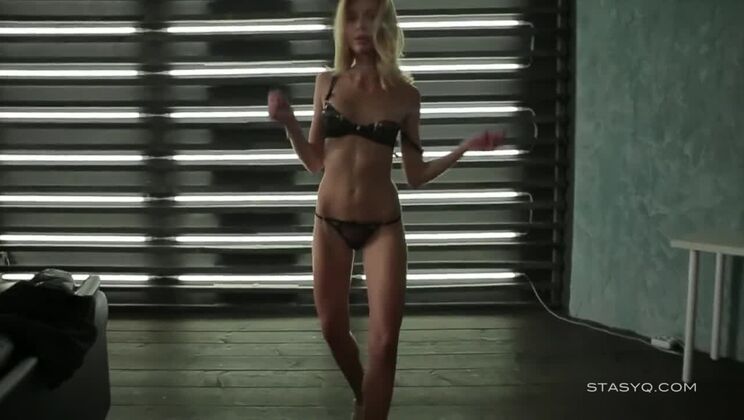 Blonde in black lingerie dancing and teasing in erotic POV video