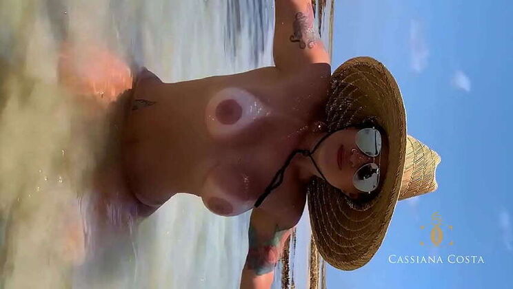 Cassiana Costa, a blonde Latina, pleasured a lucky guy on the beach, leading to an intense blowjob and a money shot in her mouth.