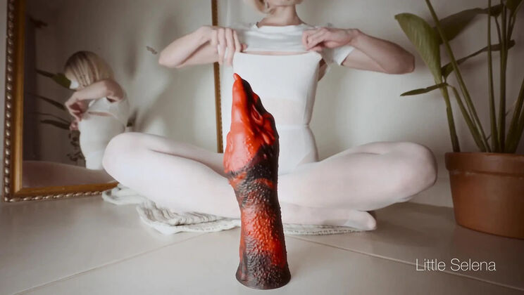 Red Hero Teases Her Tight Ass with a Huge Dildo